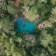 birds-eye view of blue hole in tuburan by Gho Go